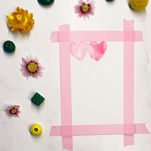 Step 2: Draw a heart next to it in a different color or shade and let it touch the previous one.