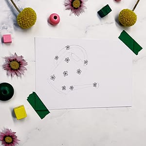 Step 2: Draw a few larger flowers within your sketched object