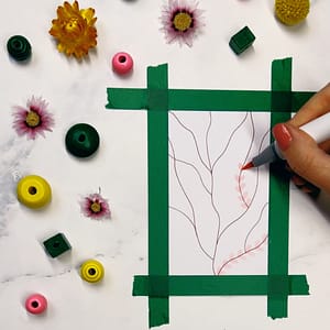 Step 2: Press your marker or brush down with the tip facing your branch and add leaves