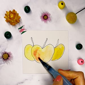 Step 3: Grab your watercolor palette and start with a light yellow color