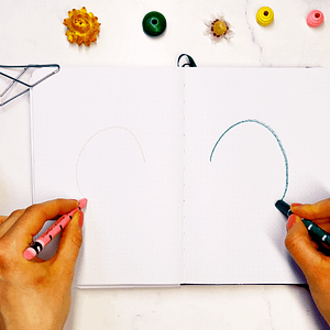 Step 1: With a crayon or pencil in each hand, begin making circular motions on your paper.