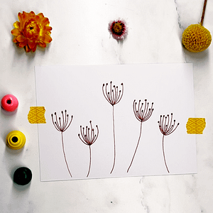 Step 3: Continue drawing more flowers with varying heights and shapes