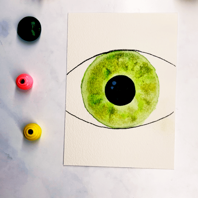 Step 6: Once the paint is dry, add some white specks to the black pupil.