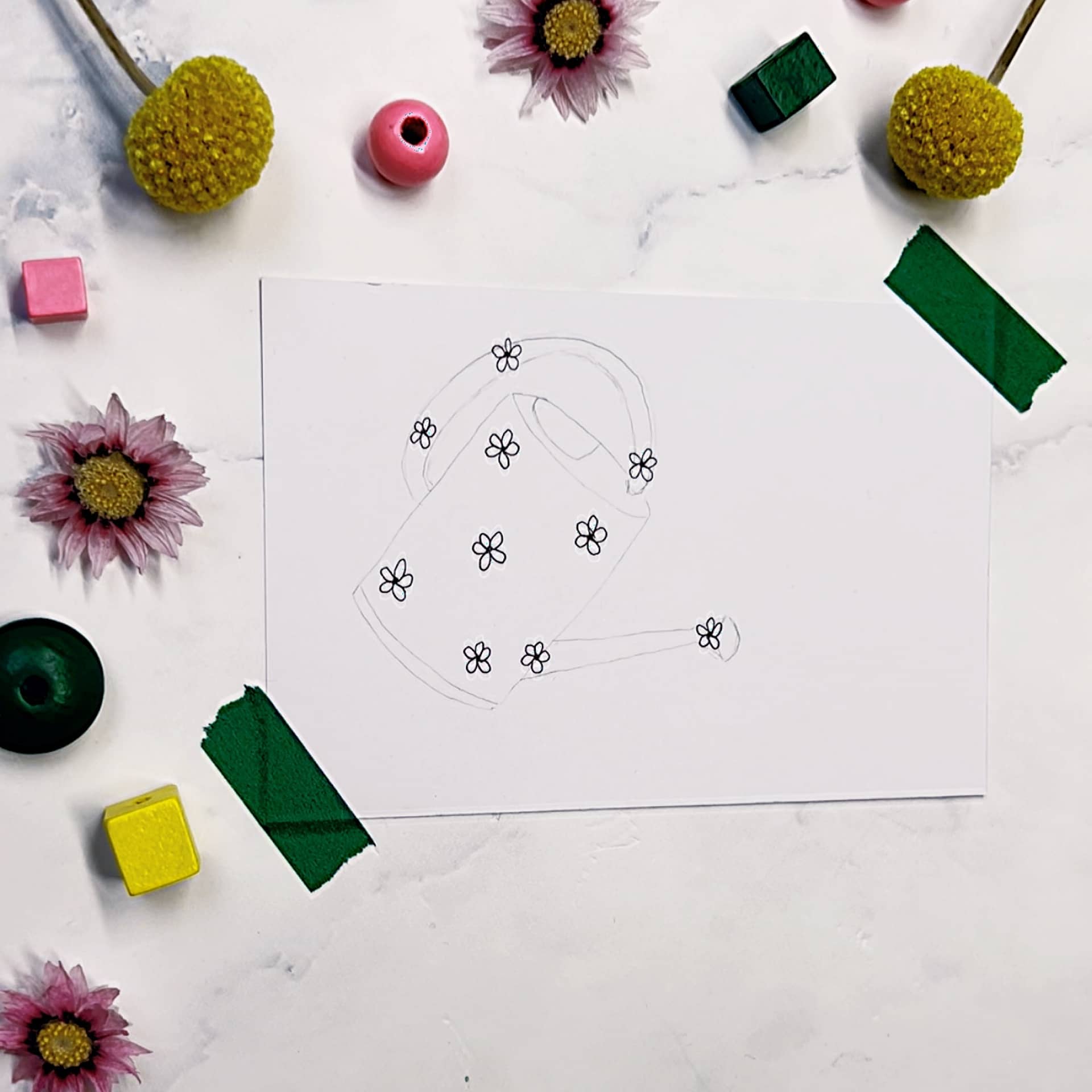 Step 2: Draw a few larger flowers within your sketched object