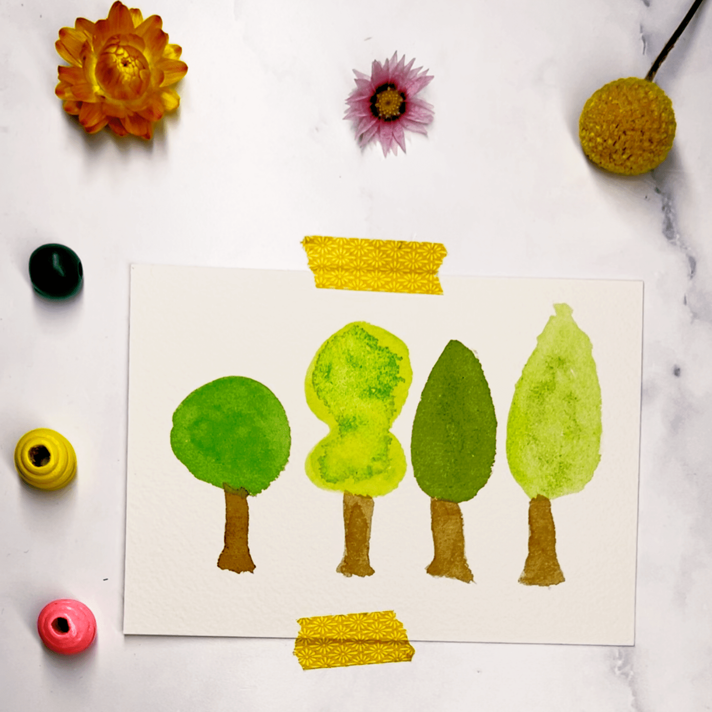 Step 2: Add the crowns of the trees in different shapes and colors.