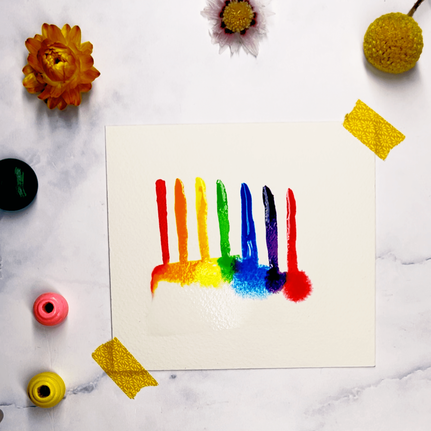Step 2: Add candles in rainbow colors on top of the cake that will end in the wet rectangle part.