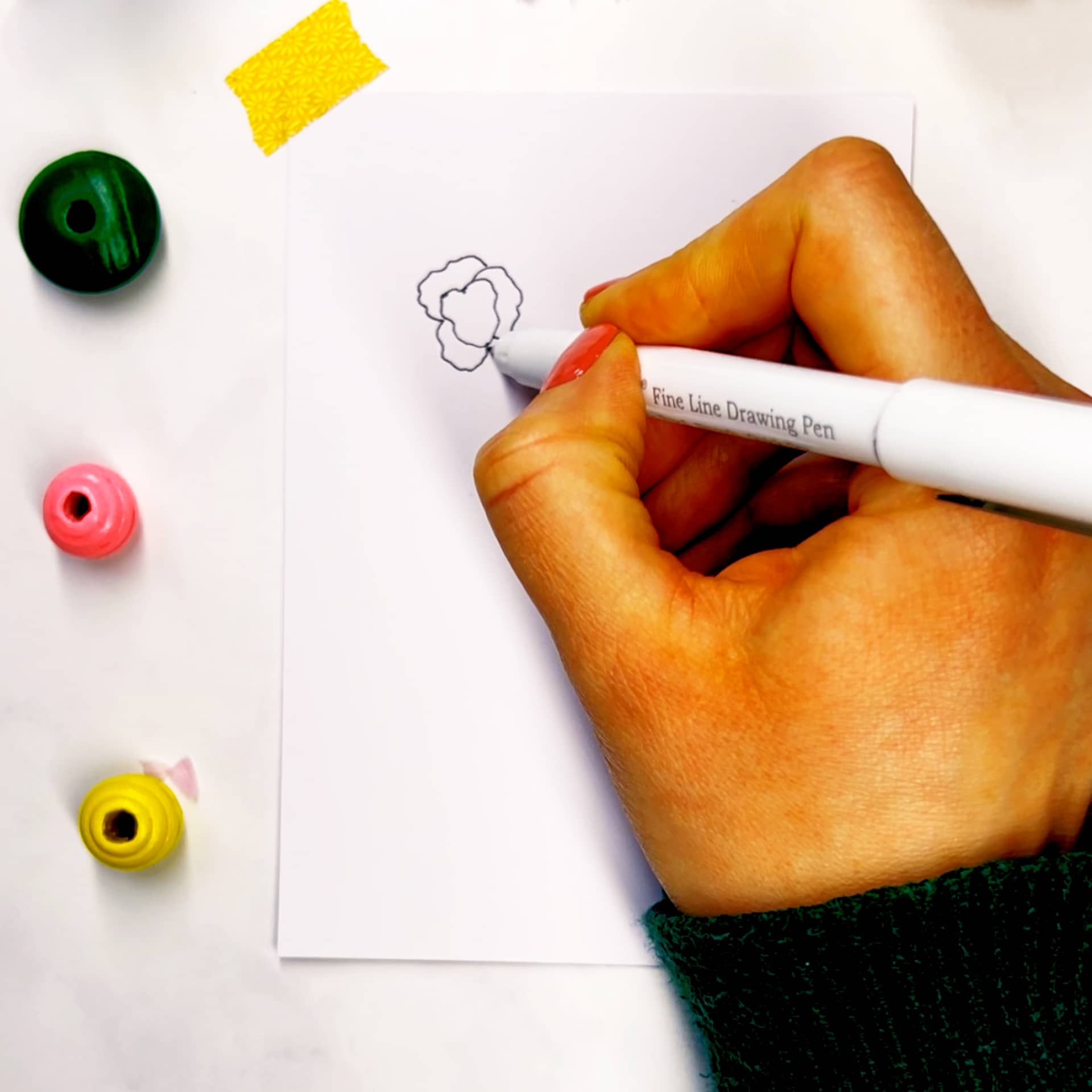 Step 1: Start with a dot and overlapping scribbled petals