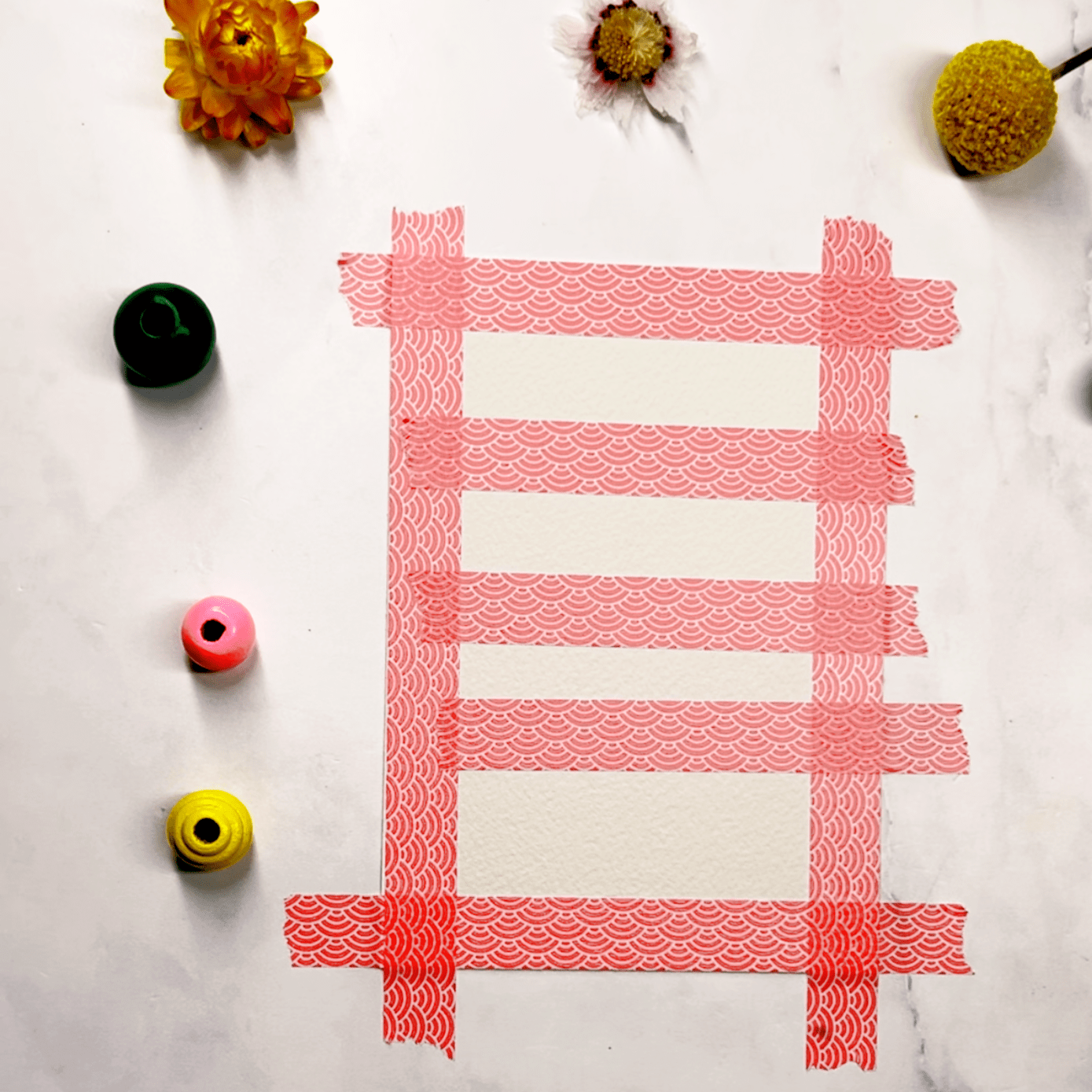 Step 1: Start by applying horizontal strips of tape across your page, leaving small gaps in between.