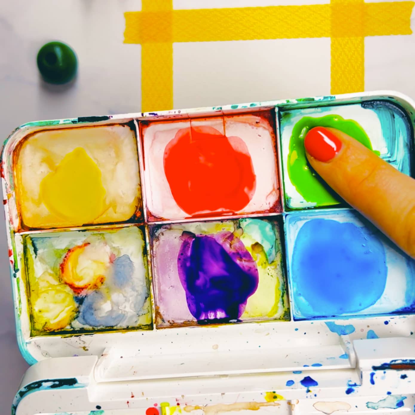 Step 1: Dip your fingertip in paint or press it against an ink pad